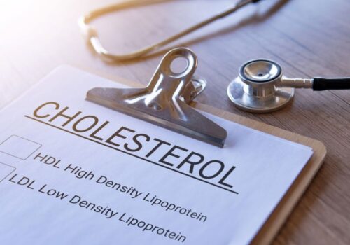 Lipid Clinic - paper with headline of cholesterol on a clipboard