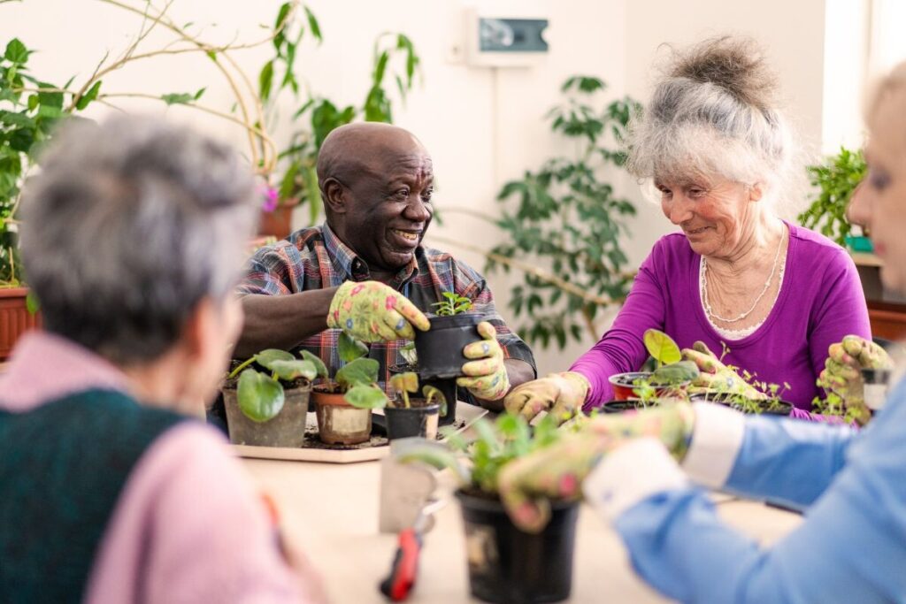 People taking part in a gardening activity via social prescribing