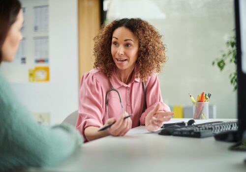 Healthcare professional consulting with patient