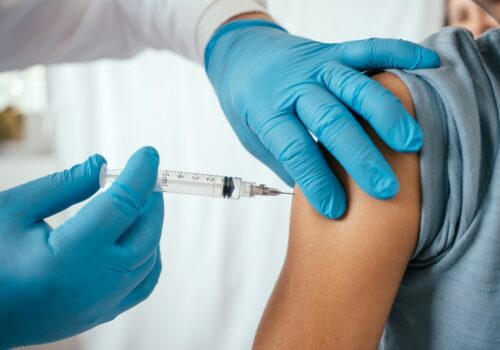 A doctor administering a vaccine.