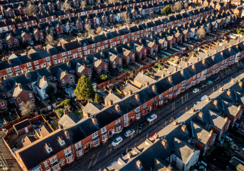 Aerial view of the rooftops of back to back terraced houses in England.