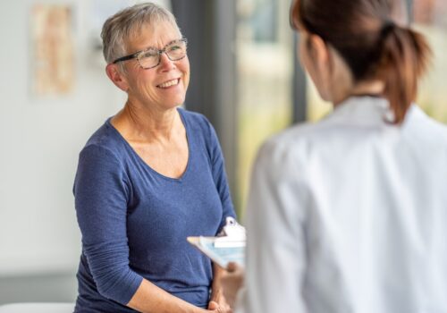 A doctor speaking to a patient.