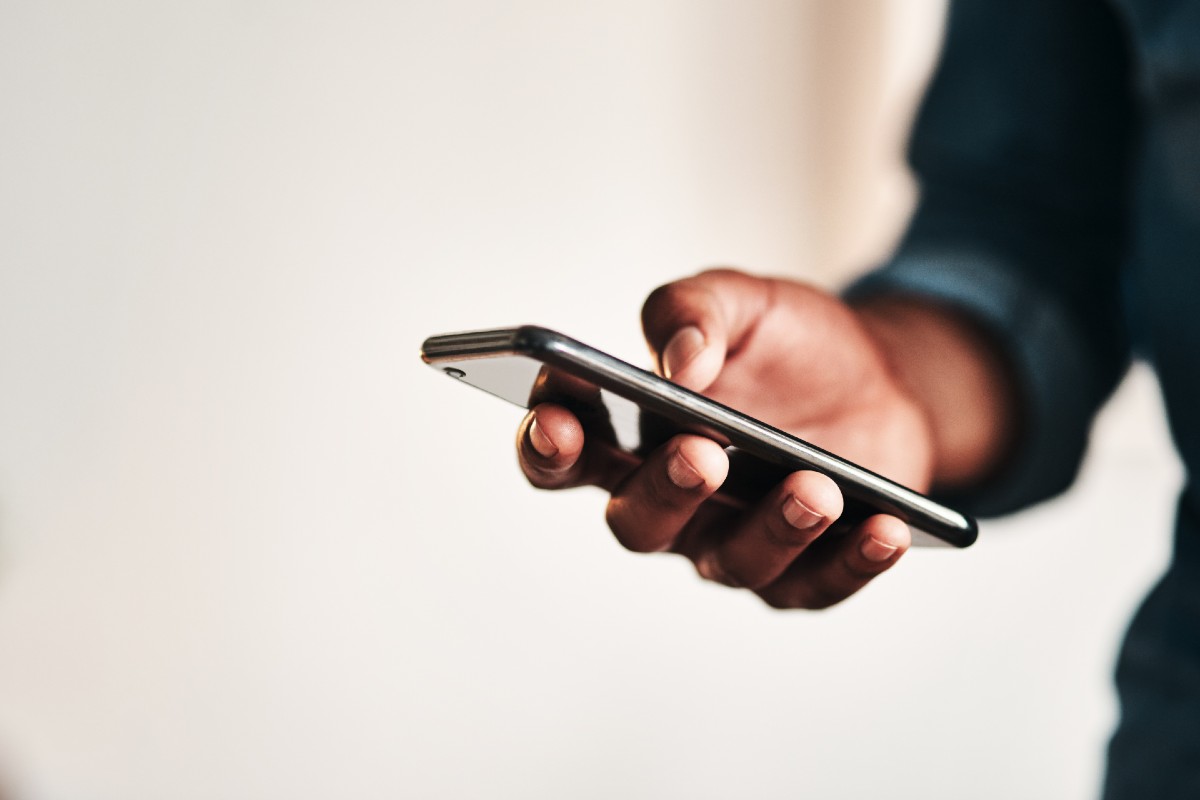 A patient using a mobile phone to access digital healthcare