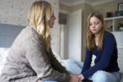 What caused this child to suddenly develop tics and obsessive behaviours?