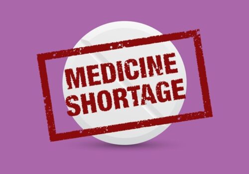 cartoon tablet with 'medicine shortage' stamp over the top