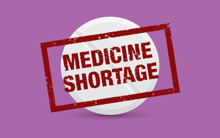 cartoon tablet with 'medicine shortage' stamp over the top