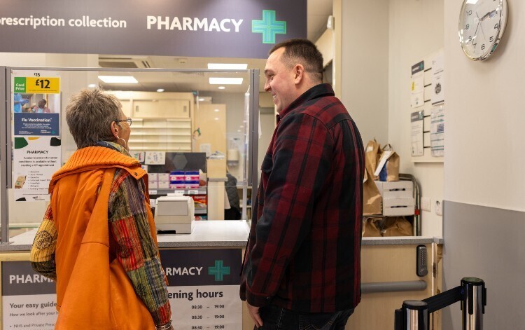 patients talking at pharmacy