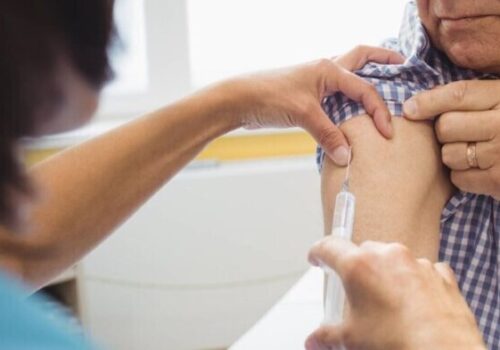 older man being vaccinated