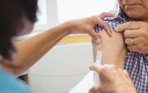 older man being vaccinated
