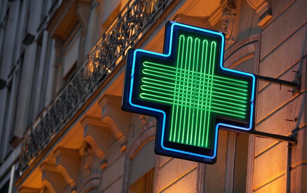 Green cross sign outside a pharmacy