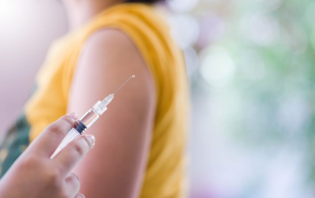 close up of pharmacist giving vaccine / flu jab