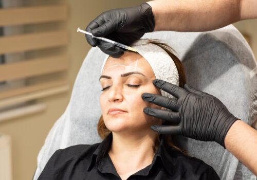 woman preparing for facial injections/cosmetic surgery
