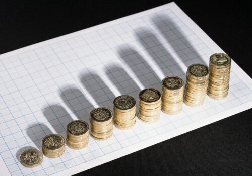 picture of pound coins in increasing stacks
