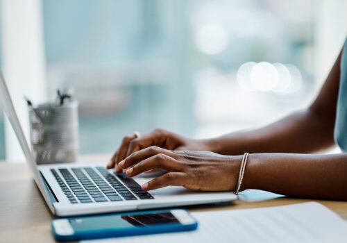 person typing on computer