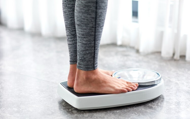 Someone standing on weighing scales