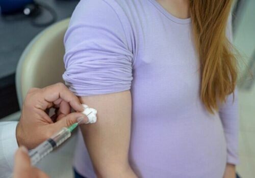 pregnant woman being vaccinated