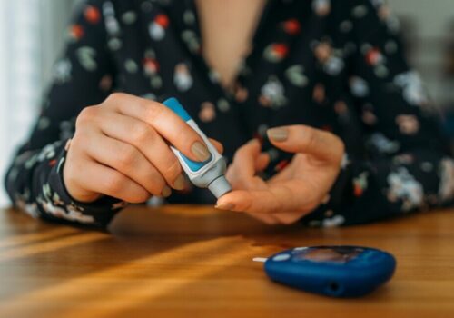 Person with diabetes checking their blood sugar