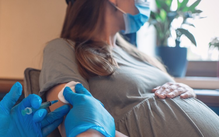 Pregnant woman receives flu vaccination
