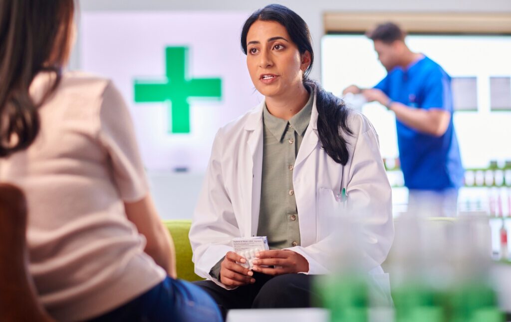 Woman talking to pharmacist