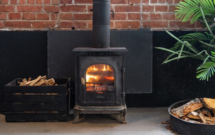 A lit indoor wood burner