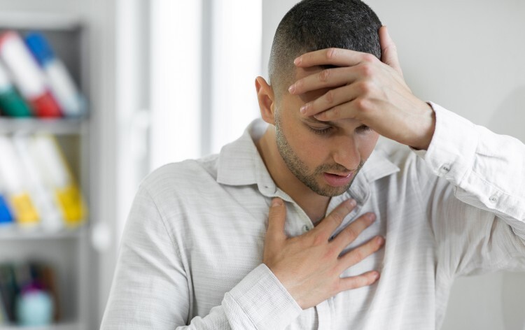 Man suffering from breathing problem -