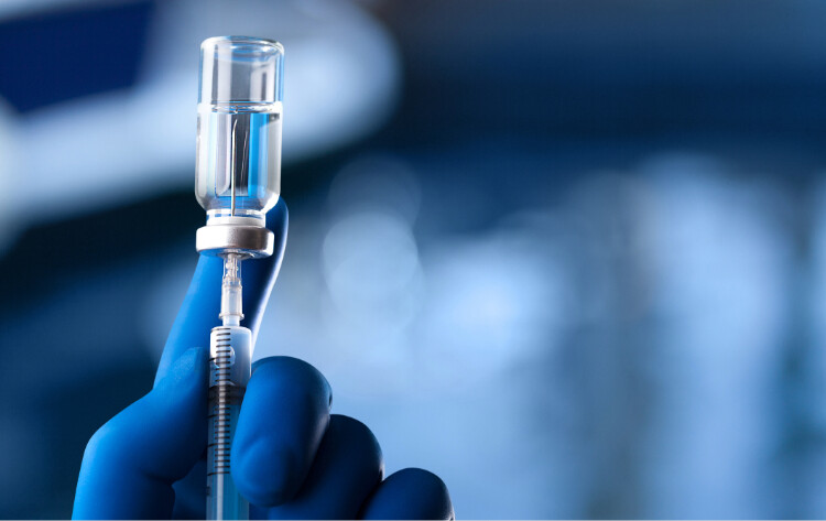 A vial of medicine and a syringe