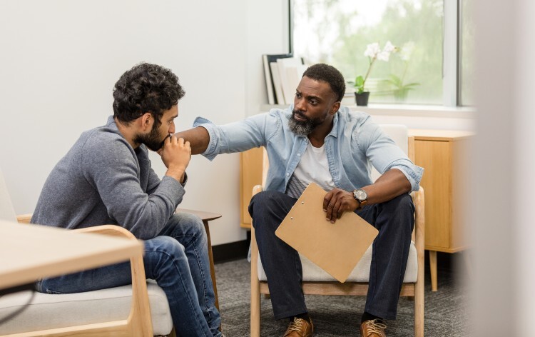 Therapist Comforting a patient during a counselling session