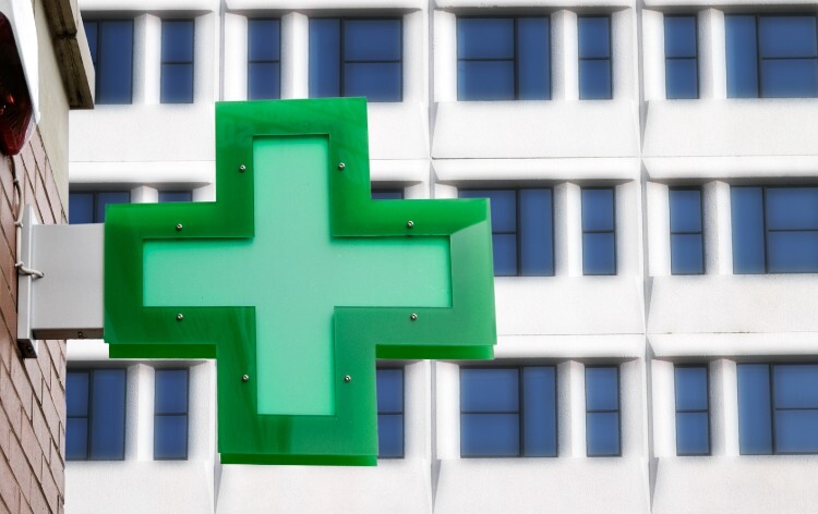 Green cross outside a pharmacy shop