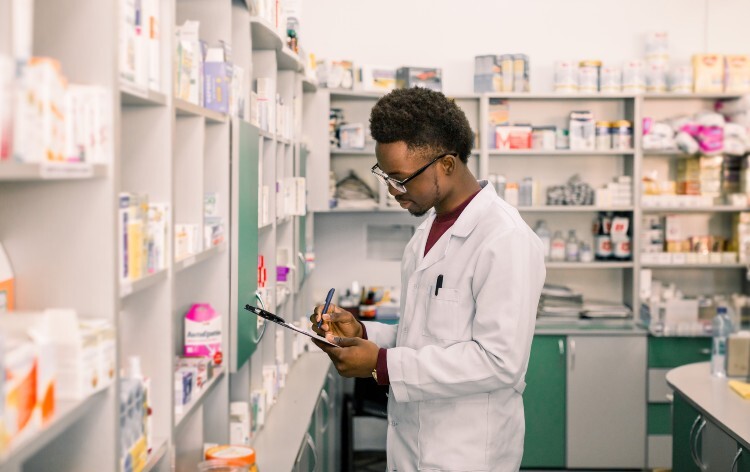 Pharmacist looking for medicines in a dispensary