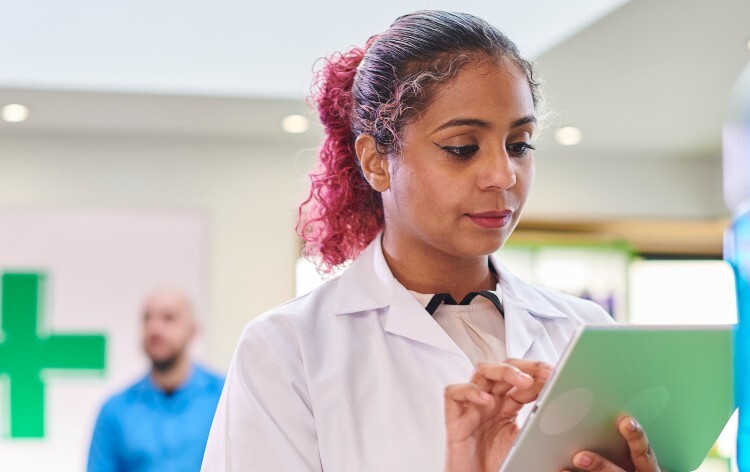 Pharmacist using a digital ipad
