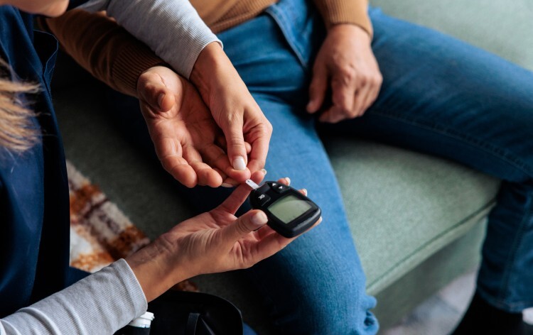 Diabetic person testing their blood sugar