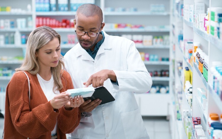 Pharmacist helps a patient in a pharmacy