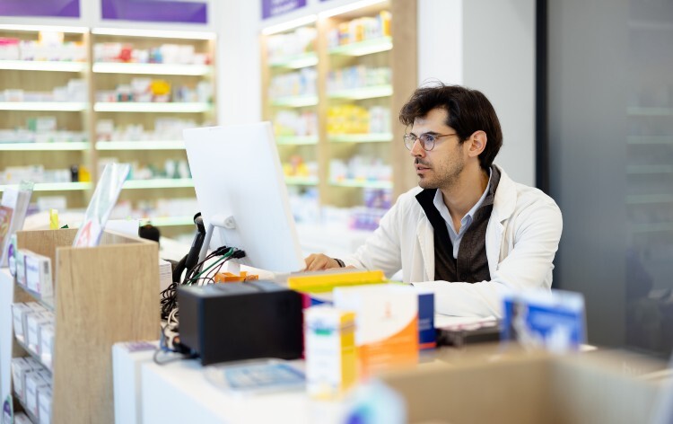 Pharmacist looking at the computer