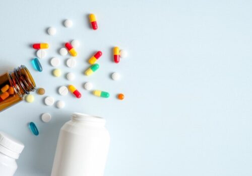 Tipped over medicines bottle spilling pills