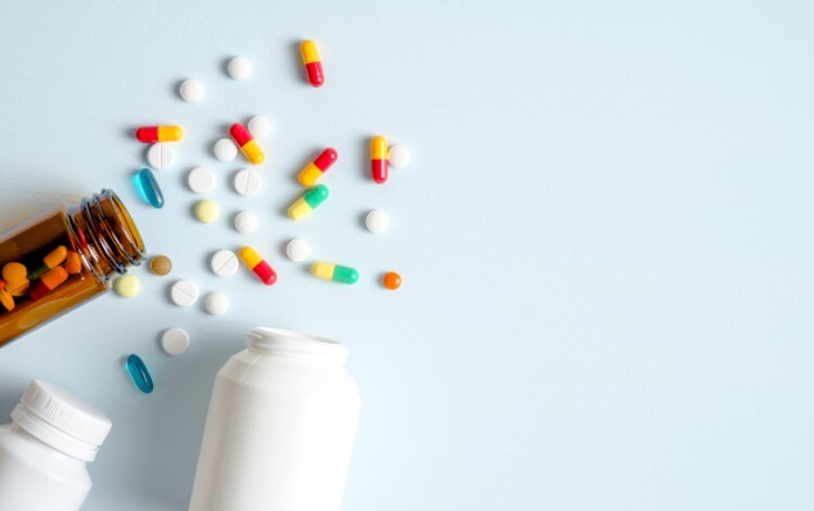 Tipped over medicines bottle spilling pills