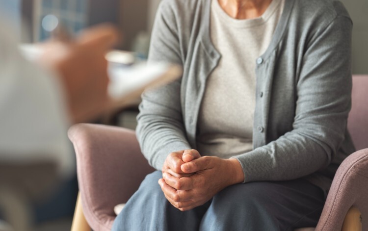Woman sits in consultation