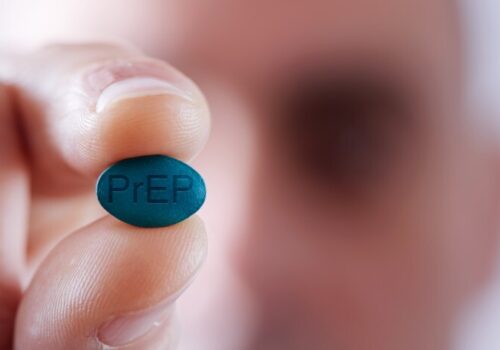 Young man with a PrEP pill