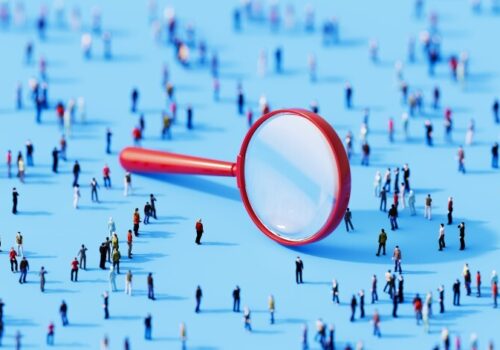 Magnifying glass and people