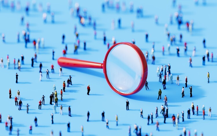 Magnifying glass and people