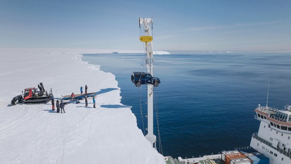 INEOS Grenadier Detour by Arcane Works being craned onto the Antarctic ice shelf