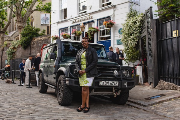 Becky Kim and her Kenyan Grenadier Trialmaster outside The Grenadier pub in Belgravia, London
