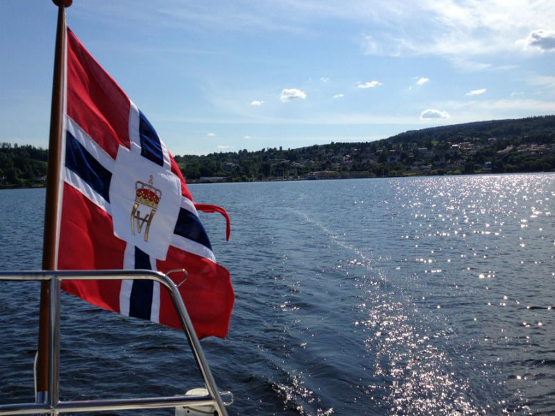 Norwegian flag over the water
