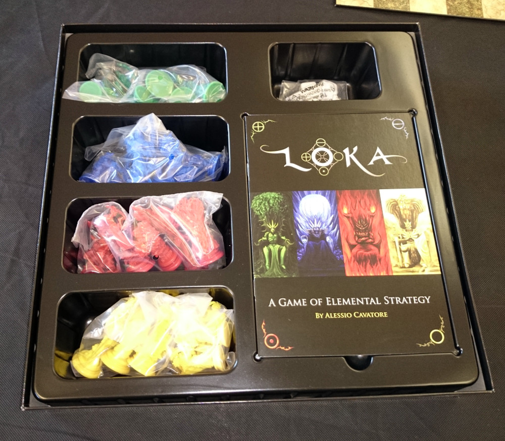Lift the board and you're greeted with a bounty of components. (As a bit of a board game nut, I'm particularly happy with the fact that everything has a set place. More of this, please, board game industry!