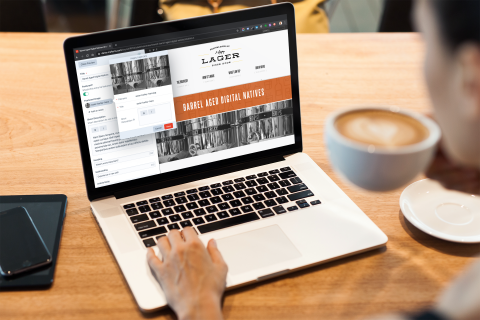 Macbook pro mockup featuring a person drinking coffee 2326 el1