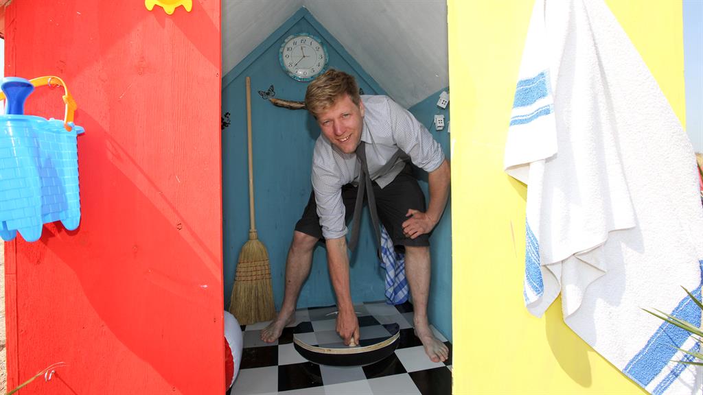 Going down: Colin lifts the cover that leads to underground rooms