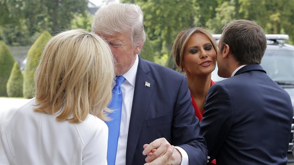 Smiles replace grimaces as Macron welcomes Trump to Paris