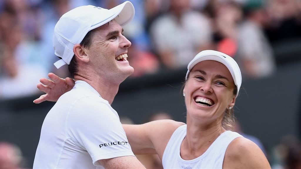 Tag team Murray and Hingis celebrate their mixed doubles final victory yesterday