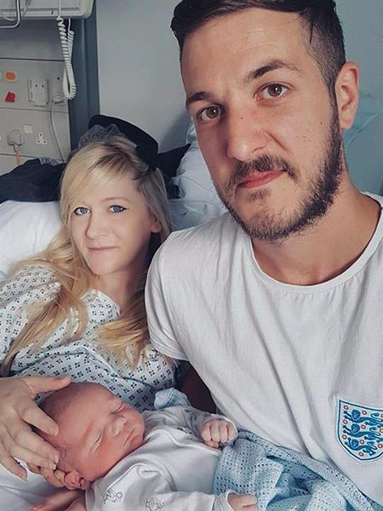 Charlie with his mum and dad PICTURE: PA
