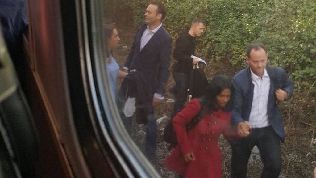 Commuters jump on train tracks to escape 'preacher'