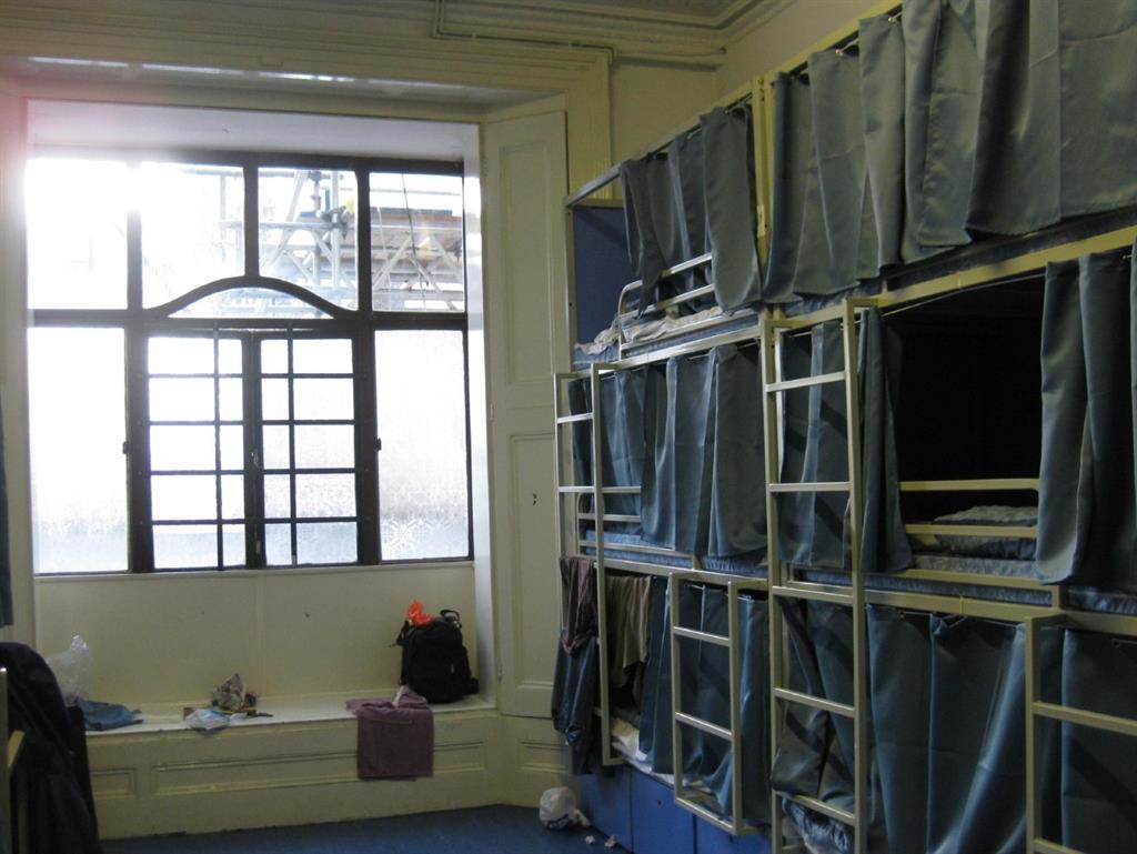 Transformed: Original features were lost behind triple bunk beds, lowered ceilings and partition walls